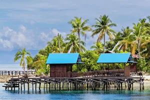 Tourist Resort Prints: A view of the dive resort at Pulau Panaki, Raja Ampat, Indonesia, Southeast Asia, Asia
