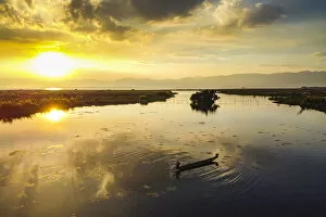 Rippled Gallery: View by drone of rowing boat at sunset, Inle Lake, Shan state, Myanmar (Burma), Asia