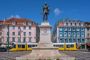 Lively Prints: View of Duke of Terceira statue and a modern tram in PC Duque da Terceira on a sunny day