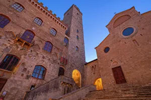 San Gimignano Prints: View of Duomo di San Gimignano in Piazza del Duomo at dusk