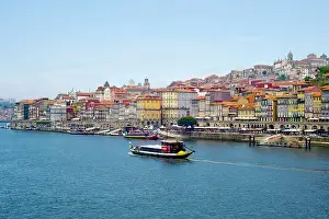 Waterfront Dining Prints: View across the Duoro River towards Porto's historic centre and embankment promenade