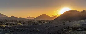 Las Palmas Prints: View of El Cuervo Volcano in Timanfaya National Park at sunset