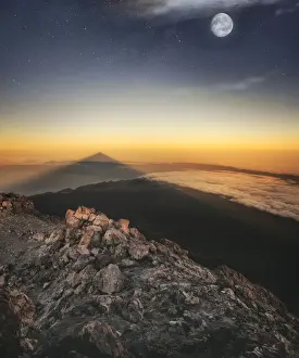 Tenerife Prints: View of El Teide volcano shadow and full moon from the summit right before the sunrise