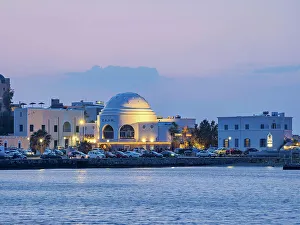 Automobiles Prints: View towards the Elli Nightclub at dusk
