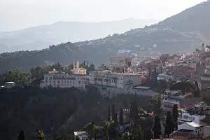 Taormina Prints: View of Etna from ancient theater in Taormina overlooking the city of Messina in Italy on a clear day