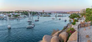 Nubia Prints: View of fellucas on the Nile river from Feryal Garden at dusk