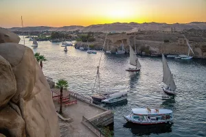 Nubia Prints: View of fellucas on the Nile river from Feryal Garden at dusk