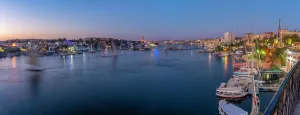 Nubia Prints: View of fellucas on the Nile river from Feryal Garden at dusk