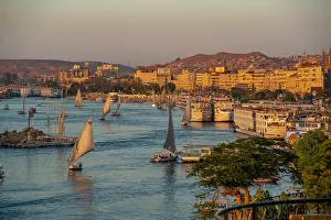 Nubia Prints: View of fellucas on the Nile river from Feryal Garden during golden hour
