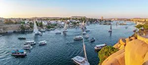 Nubia Prints: View of fellucas on the Nile river from Feryal Garden during golden hour