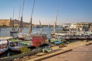 Nubia Prints: View of fellucas on the Nile river on a sunny day