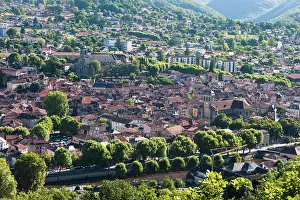 Wanderlust Prints: View of Figeac showcasing rooftops, trees, and buildings in Midi-Pyrenees in France