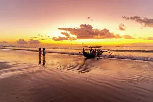 Canoe Prints: View of fishing outrigger on Kuta Beach at sunset