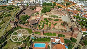 Stones Prints: View from above of the fortified city of Silves with historical castles and modern buildings in Algarve