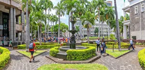 Water Fountain Prints: View of fountain and trees in Place d'Armes in Port Louis