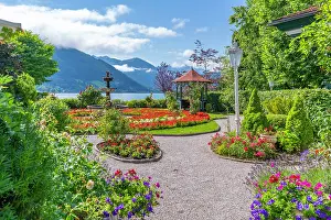 Blossom Prints: View of garden overlooking Lake Zell in Zell am See on a sunny day