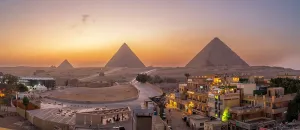 Terrace Prints: View of Giza Pyramids from rooftop terrace at dusk, Cairo, Egypt, Africa