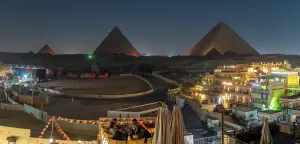 Terrace Prints: View of Giza Pyramids from rooftop terrace during light show, Cairo, Egypt, Africa