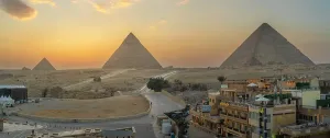 Hues Prints: View of Giza Pyramids from rooftop terrace at sunset, Cairo, Egypt, Africa
