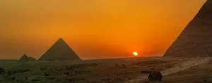 Mystical Prints: View of Giza Pyramids from rooftop terrace at sunset, Cairo, Egypt, Africa