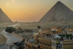 Terrace Prints: View of Giza Pyramids from rooftop terrace at sunset, Cairo, Egypt, Africa