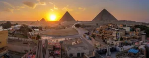 Terrace Prints: View of Giza Pyramids from rooftop terrace at sunset, Cairo, Egypt, Africa