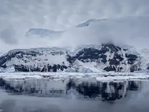 Polar Climate Prints: View of the glacier covered volcano called Peter I Island in the Bellingshausen Sea