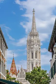 Budapest Prints: View of Gothic Matthias Church tower with nearby buildings in Castle District