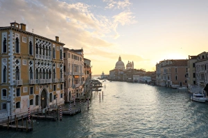 View along Grand Canal towards Santa Maria Della Salute from Accademia Bridge at sunrise View along Grand Canal towards Santa Maria Della Salute from Accademia Bridge at sunrise
