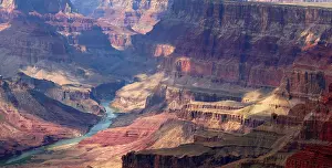 Slopes Prints: View of Grand Canyon with Colorado River flowing through deep canyon in Arizona USA during daylight hours in summer