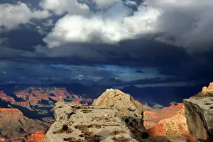 Grand Prints: View of Grand Canyon from South Rim showing distant formations and cloudy sky during late afternoon light