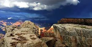 Grand Prints: View of Grand Canyon from South Rim showing rocks and stormy sky over the landscape in Arizona