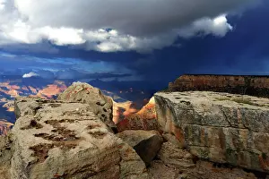 Grand Prints: View of Grand Canyon from the South Rim shows rocky formations and dark sky over the landscape in Arizona