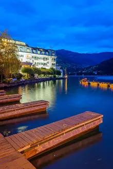 Aesthetics Prints: View of the Grand Hotel by Lake Zell at dusk in Zell am See