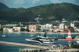 Umbrella Prints: View of Great Bay Beach with promenade and boats in Philipsburg