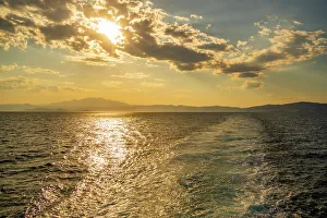 Blue Water Prints: View of Greek mainland from ferry at sunset