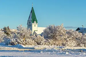 Snowflakes Prints: View of Hafnarfjaroarkirkja church in Hafnarfjorour in winter, Hafnarfjorour, Iceland