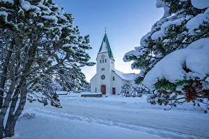 Frosted Prints: View of Hafnarfjaroarkirkja church at sunrise in winter, Hafnarfjorour, Reykjavik, Iceland