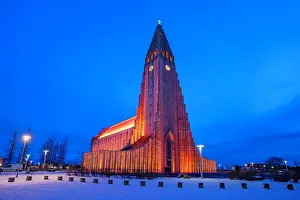 Festivity Prints: View of Hallgrimskirkja church illuminated at dusk in winter, Reykjavik, Iceland