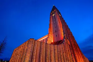Shot Prints: View of Hallgrimskirkja church illuminated at dusk in winter, Reykjavik, Iceland