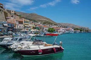 Kalimnos Prints: View of harbour boats in Kalimnos with hills in the background