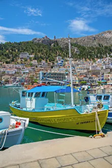 View of harbour boats in Kalimnos with hills in the background, Kalimnos, Dodecanese Islands, Greek Islands, Greece, Europe