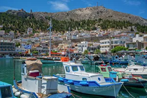 View of harbour boats in Kalimnos with hills in the background, Kalimnos, Dodecanese Islands, Greek Islands, Greece, Europe