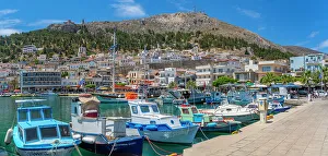View of harbour boats in Kalimnos with hills in the background, Kalimnos, Dodecanese Islands, Greek Islands, Greece, Europe
