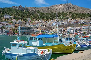 View of harbour boats in Kalimnos with hills in the background, Kalimnos, Dodecanese Islands, Greek Islands, Greece, Europe