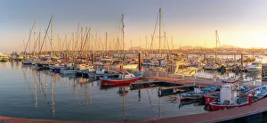 Corralejo Prints: View of harbour boats at sunset