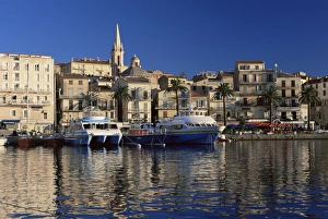 View across harbour to church of Ste. Marie in the early morning, Calvi