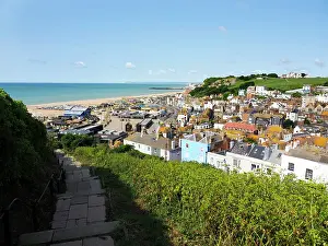 Hastings Prints: View over Hastings Old Town from East Hill offers a clear sight of the coastline and the buildings below