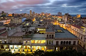 Derelict Prints: View over Havana Centro at night from 7th floor of Hotel Seville showing contrast of old