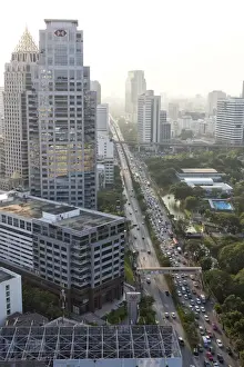 Congestion Prints: View of high rise buildings and traffic congestion on Rama IV in hazy evening light